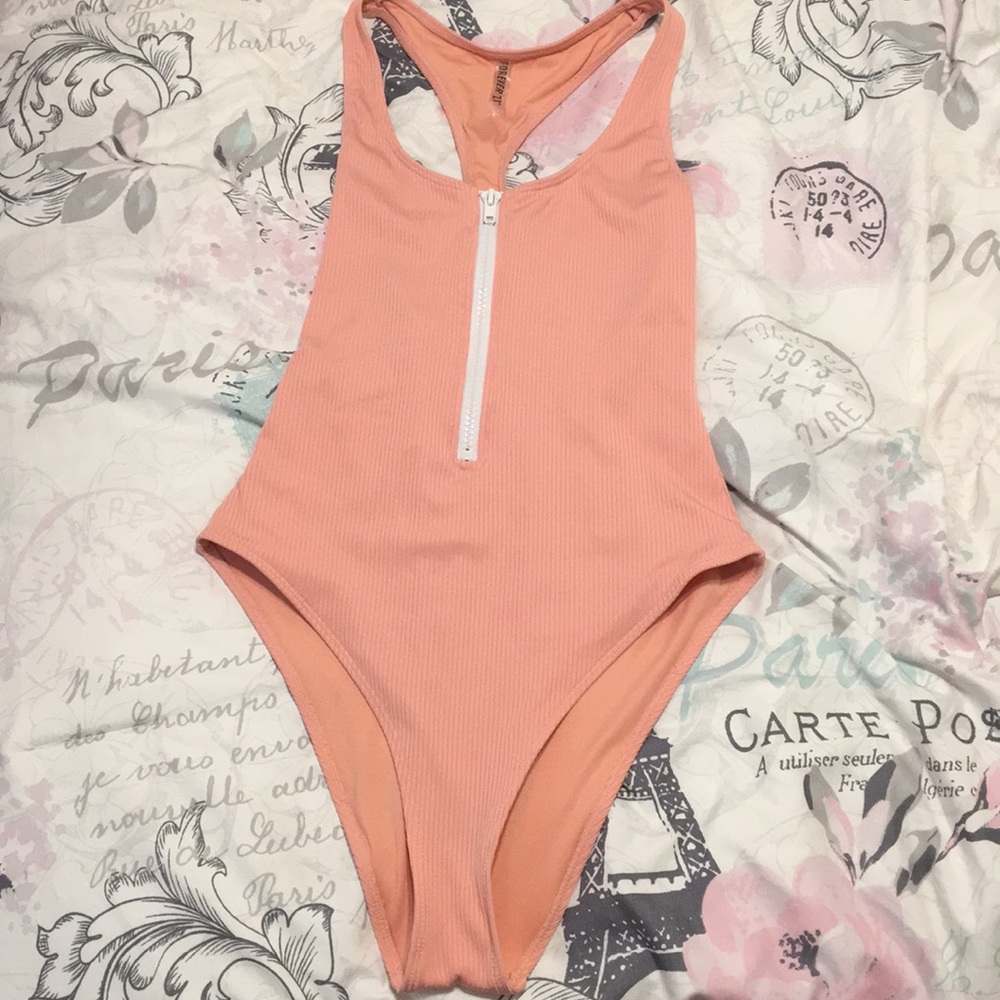 I’m selling a pink one pice bathing suit.
